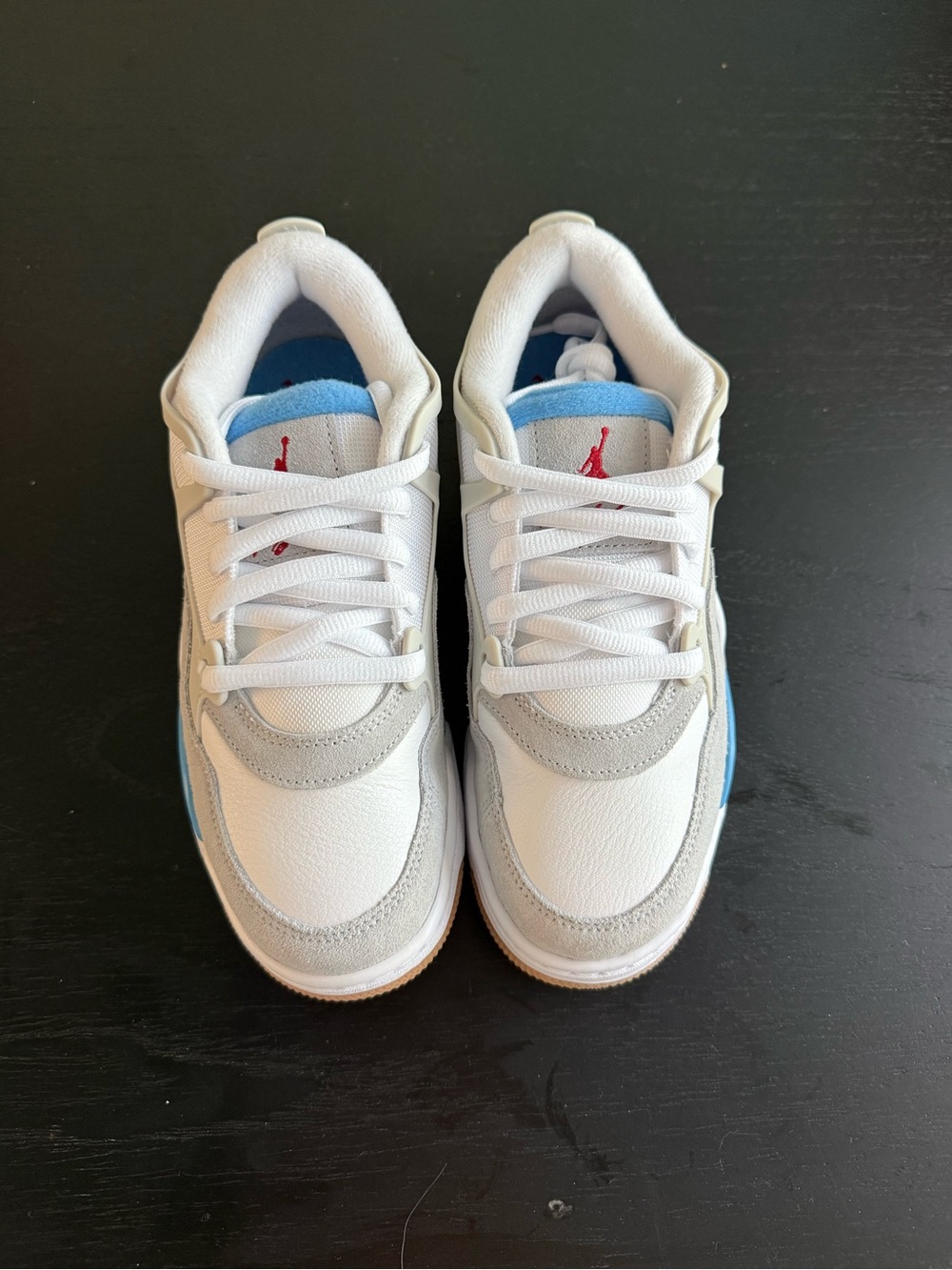 Jordan 4 Rm White Sneakers with Light Blue and Grey Accents